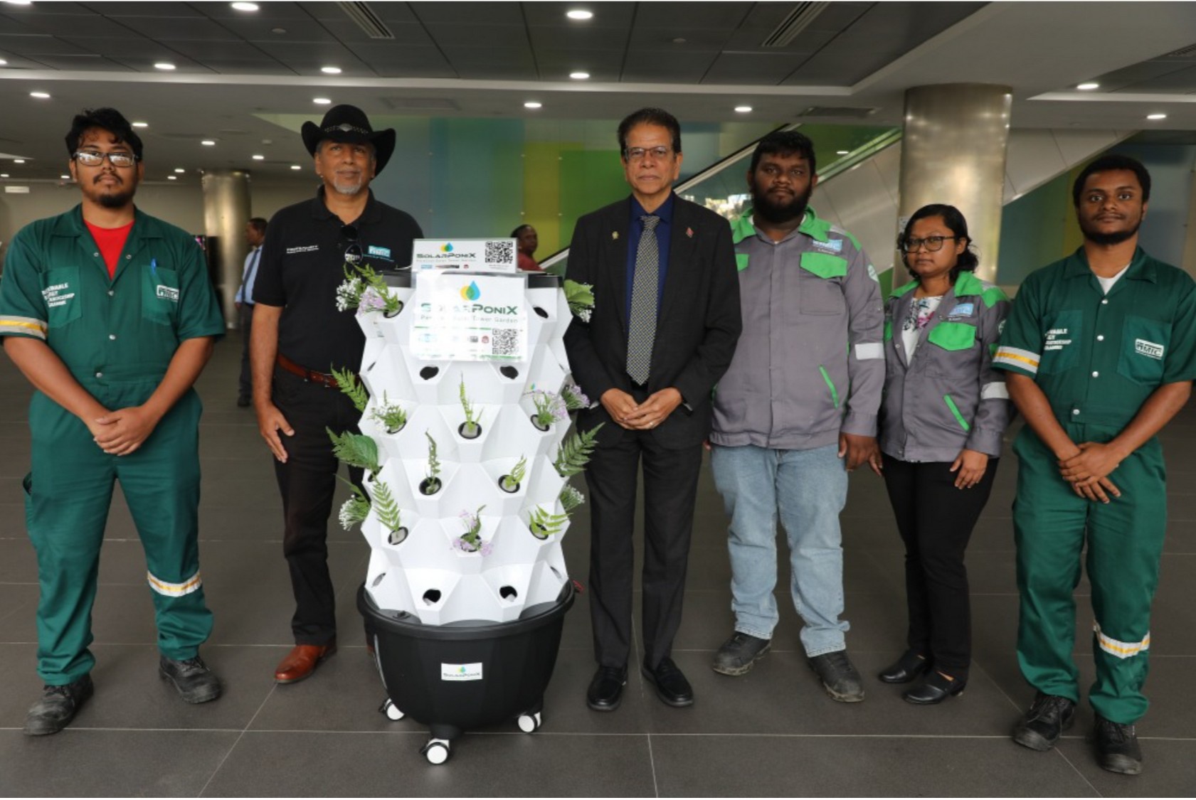 Ancel Bhagwandeen, technical trainees and partners with an actual SolarPoniX unit